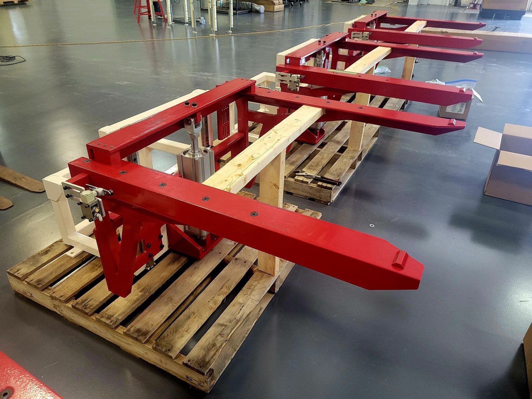 Powder-coated fabricated lifter arms palletized for shipment