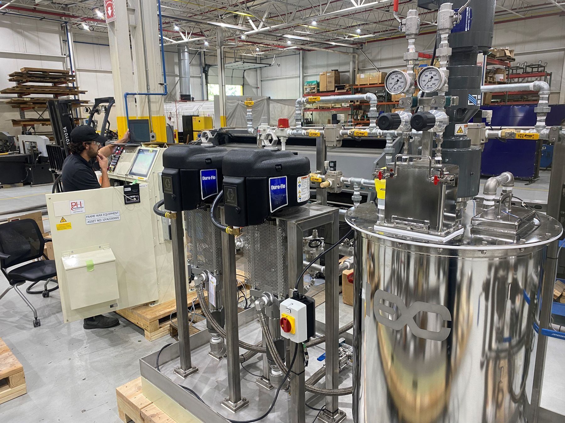 Wax line pump skid with PH control panel during installation